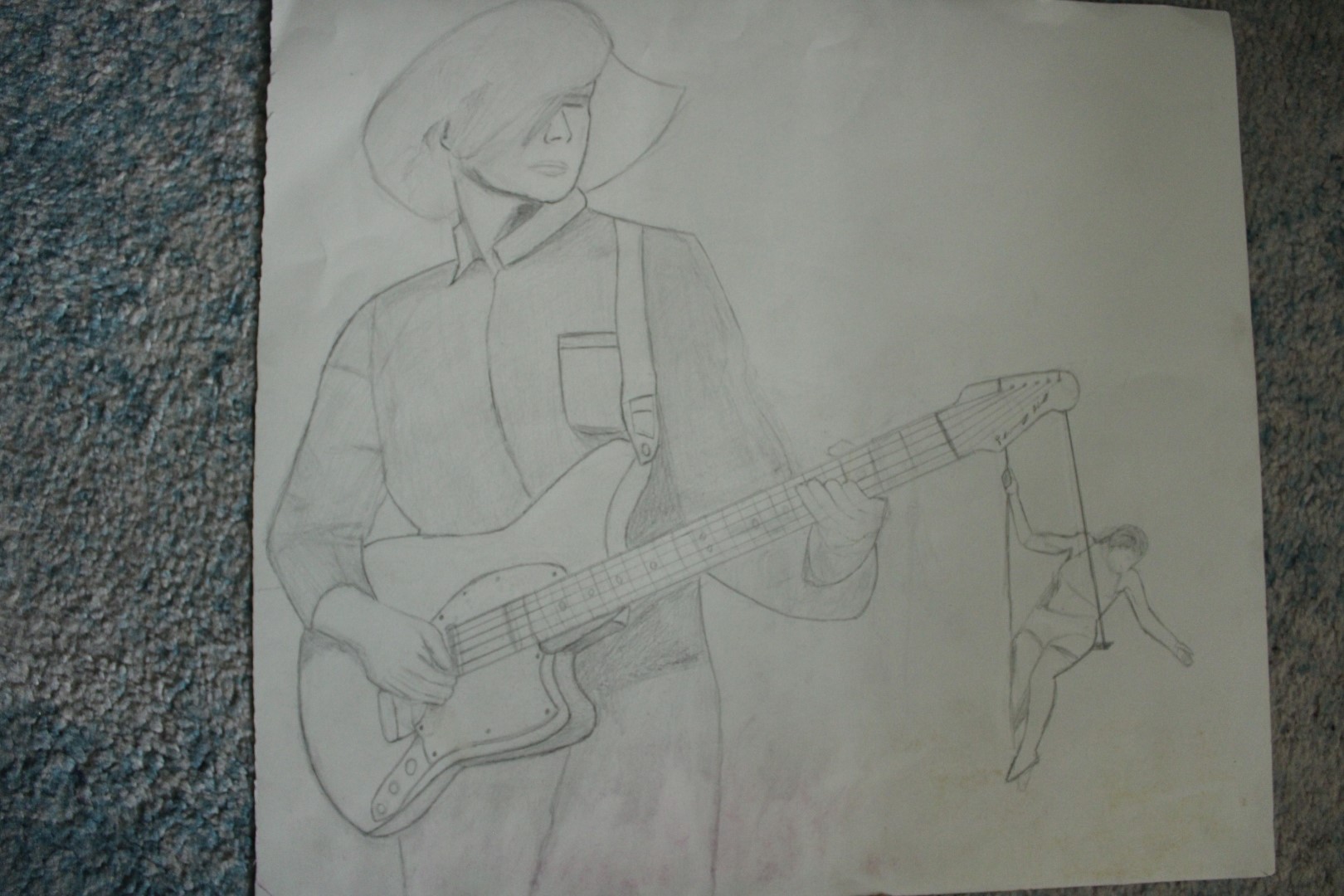 pencil drawing of a woman playing guitar with another person swinging from the head of the guitar leading from the stings of said guitar